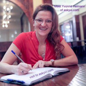 Yvonne Heimann sitting at a desk with notepad